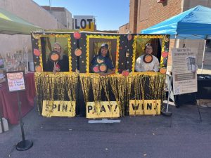 Discover Downtown Redwood Falls had an info booth and human slot machine game during Saturday’s Fall Festival to raise funds to transform the empty lot on 2nd Street into a Pocket Park. Photo by Ava Lund